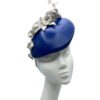 Blue leather teardrop with white leather flower detail.